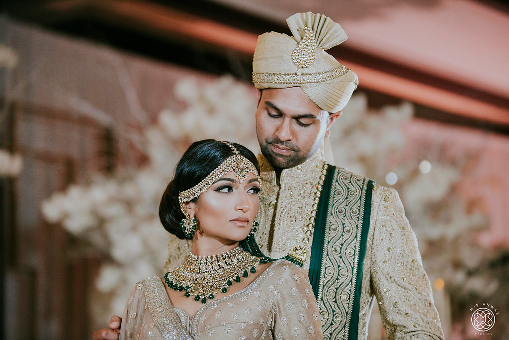 Bride and groom in their coordinated wedding attire