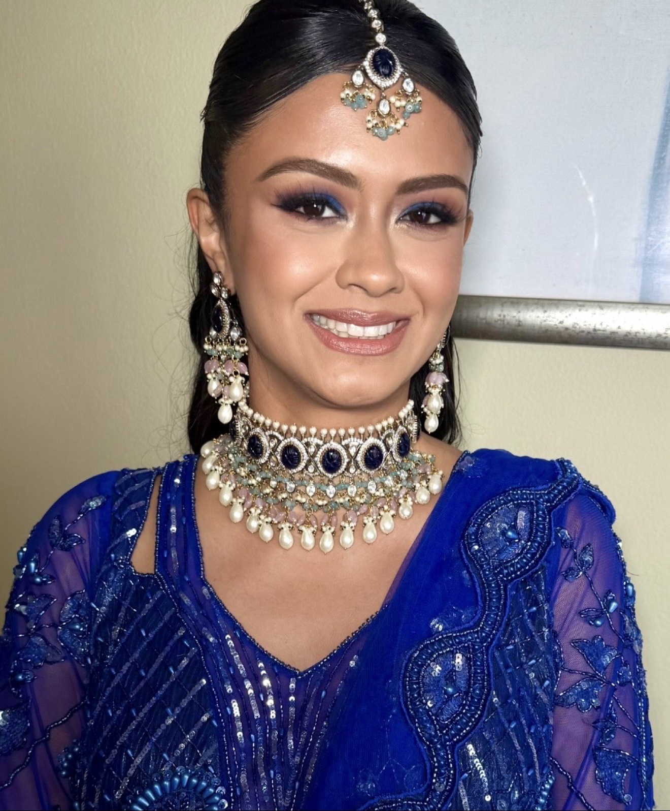 Indian bride in royal blue with sapphire choker and maang tikka by JTorry